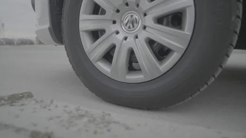 Close up of VW tire starting in front of business building Stock Footage 74696630