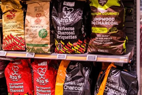 Close Up Of A Waitrose Supermarket Display Featuring Big K BBQ Charcoal Bags Stock Photos