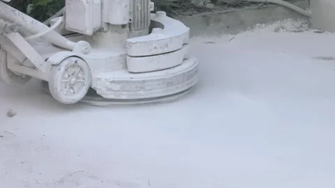 Close up of Walk behind concrete grinder machine polishing floor surface while Stock Footage 343043260