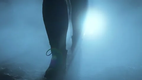 Close-up of walking feet on the path after the rain through the fog. Stock Footage 236373216