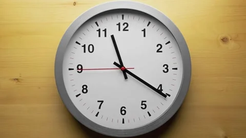 Close up a wall clock arrow showing hour and minute hand moving clockwise r.. Stock Footage 272761226