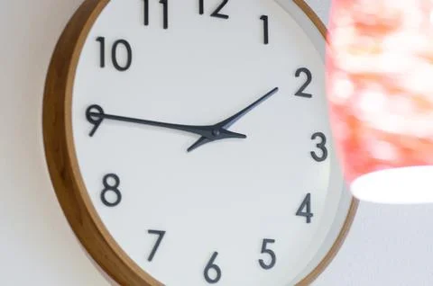 Close-up of a wall clock-the dial with hands. 스톡 사진