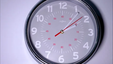 Close-up of a wall clock with moving hands showing running time. Stock Footage 337137718