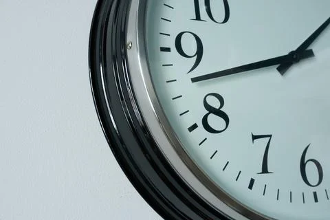 Close up of a wall clock showing eight o'clock in the morning Stock Photos