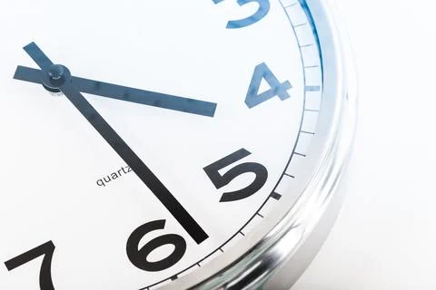 Close up of a wall clock. Time management concept Stock Photos
