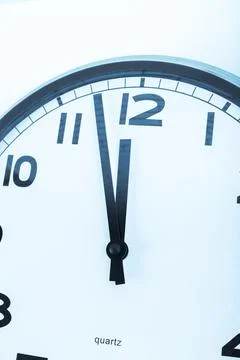 Close up of a wall clock. Time management concept Stock Photos