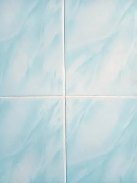 Close-up of a wall covered with light blue tiles 스톡 사진