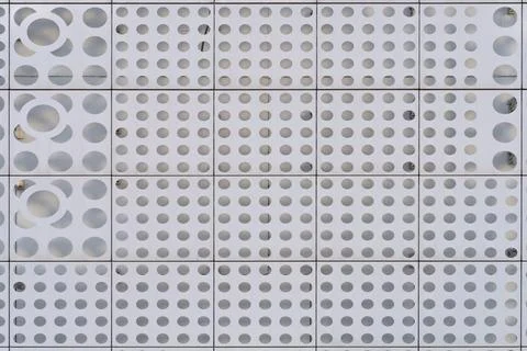 Close up of a wall of gray color with a pattern of circle geometric shapes Stock Photos
