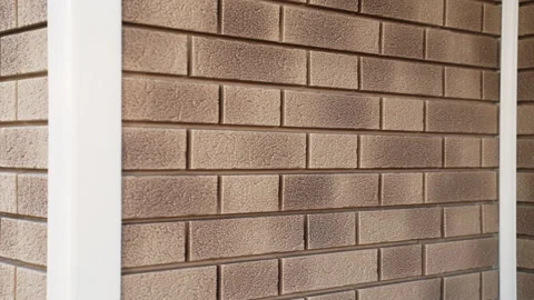 Close-up of wall of house from light flexible facade panel imitation of clinker Stock Footage 166174278