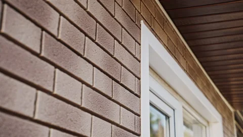 Close-up of wall of house from light flexible facade panel imitation of clinker Stock Footage 166175085