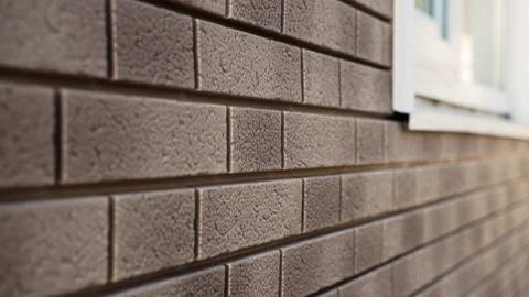 Close-up of wall of house from light flexible facade panel imitation of clinker Stock Footage 166175402