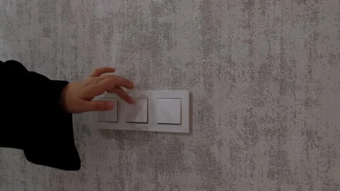 Close-Up of Wall Light Switch with Lights Turned Off  Home Lighting and Energy Stock Footage 302687980