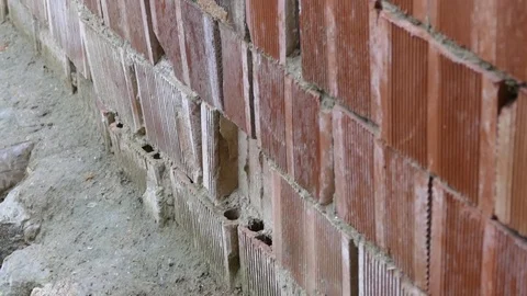 Close-up on a wall, made with bricks Stock Footage 100889958