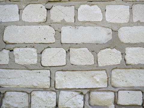 Close-up of a wall of white blocks. cement mix between blocks Stock Photos