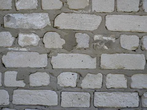Close-up of a wall of white blocks. cement mix between blocks Stock Photos