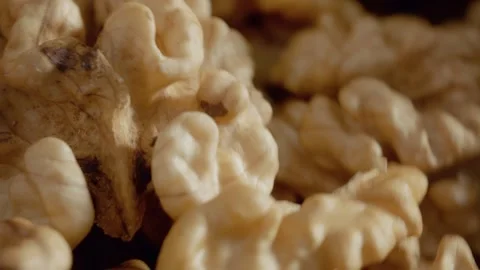 Close-up of walnut kernel revealing its detailed texture and shape Stock Footage 327581979
