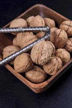 Close up of walnuts and a nutcracker. Stock Photos