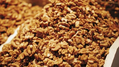 Close-up of walnuts on the counte. Assorted snacks at the food market Stock Footage 139763196