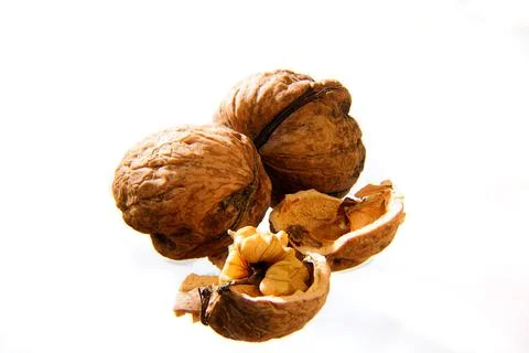 Close-Up Walnuts With Cracked Shells On White Background - Healthy Organic .. Stock-Fotos