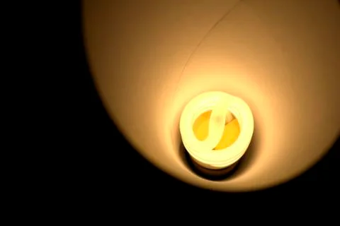 Close up of a warm light CFL bulb. Stock Photos