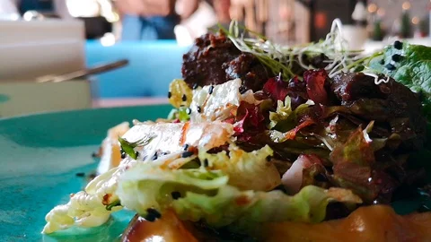 Close-up of warm salad with chicken liver Stock Footage 103853285