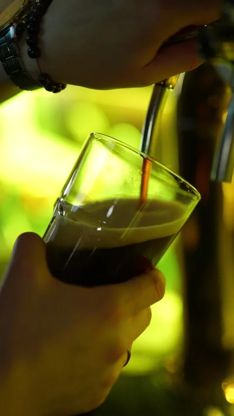A close-up, warmly lit shot of a bartender’s hands Stock Footage 328948843