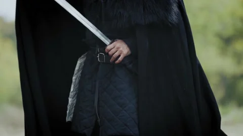 Close up of a warrior taking his sword out of the sheath, 4k 動画素材 143122592