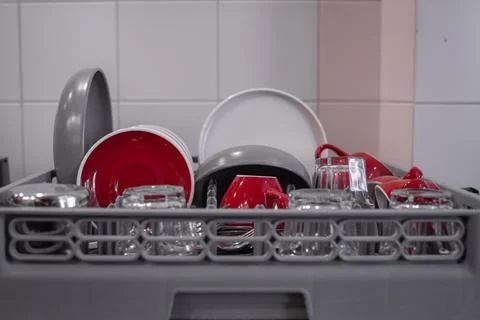 Close-up of washed cups and plates drying in the kitchen. Close-up of clean Stock Photos