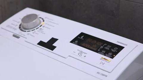 Close-up of washing machine control panel with active wash program displayed  Video stock 291180289