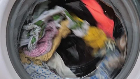 Close-up of washing machine in the process, wash clothes in the washing machine Video stock 258261300