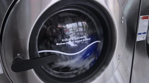 Close-Up,The washing machine is running. Stock Footage 140611899