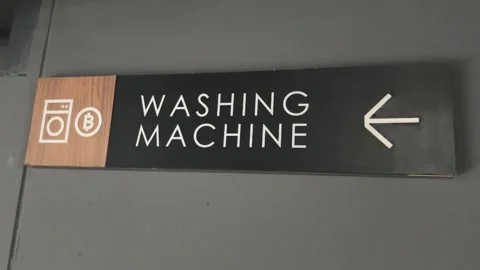 Close-up of “Washing Machine” sign with icon and arrow Stock Footage 312097411