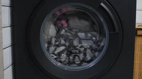 Close-up of washing machine washes dirty clothes Vídeo Stock 256681557