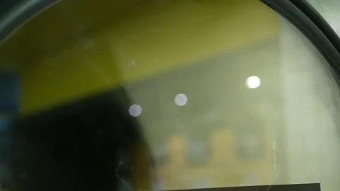 Close up to washing machine washes laundry colored clothing and sheets wash.. Stock Footage 230920543