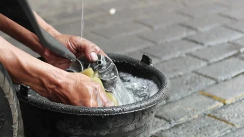 Close up washing motorcycle engine components Stock Footage 303136445