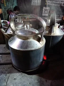 Close up water boiling using charcoal at old aluminium kettle Stock Photos