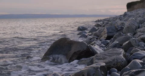 Close Up of Water Breaking Over Rock Stock Footage 205882484