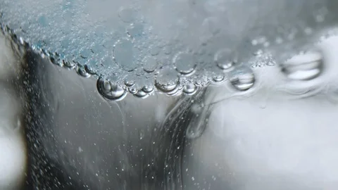 Close-up of water bubbles at effervescent tablet Stock Footage 124066620