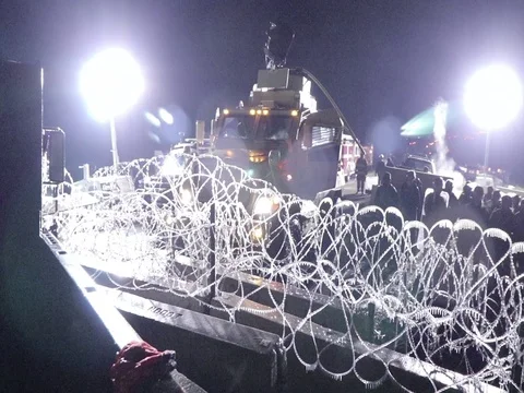 Close-up water cannon MRAP ice on razor wire Standing Rock Sioux Tribe 스톡 동영상 77280892