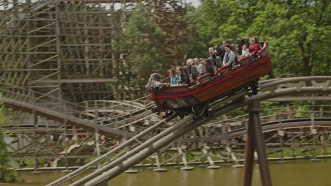 Close up of a water coaster splashing down in a pond of water in the Efteling Video stock 338033889
