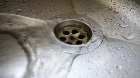 Close-up of water draining into the sink Stock Footage 93594448