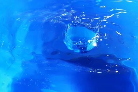 Close up on water drop crown Stock Photos