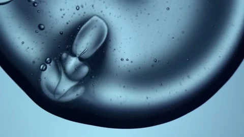 Close-up of a water drop falling on another drop of water Stock Footage 165457022