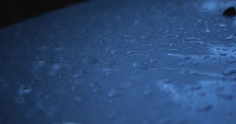 Close-Up Of Water Droplets On Car Surface During Rain... Stock Footage 332075607