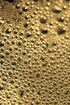 Close Up of Water Droplets Liquid Bubbles Abstract Background in Gentle Gol.. Stock Photos