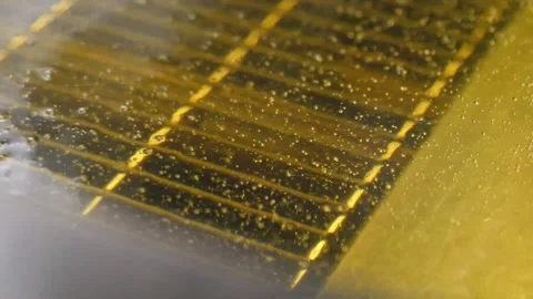 Close-up of Water Droplets on Solar Panel Grid in Golden Light Video stock 343028109