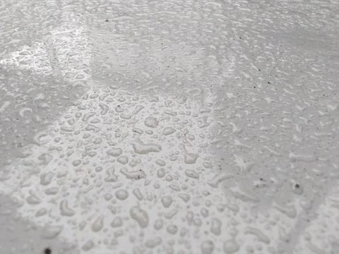 Close up of water droplets on a textured surface, abstract background. Stock Photos