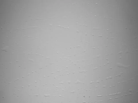 Close-up of water droplets on a white surface Illustrazione stock