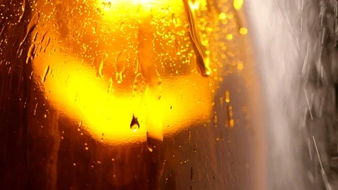 Close-up of Water drops on the cold beer bottle glass in slow motion Stock Footage 126017960