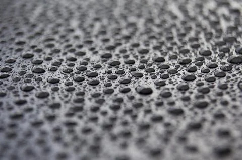 Close up of water drops on dark background Stock Photos